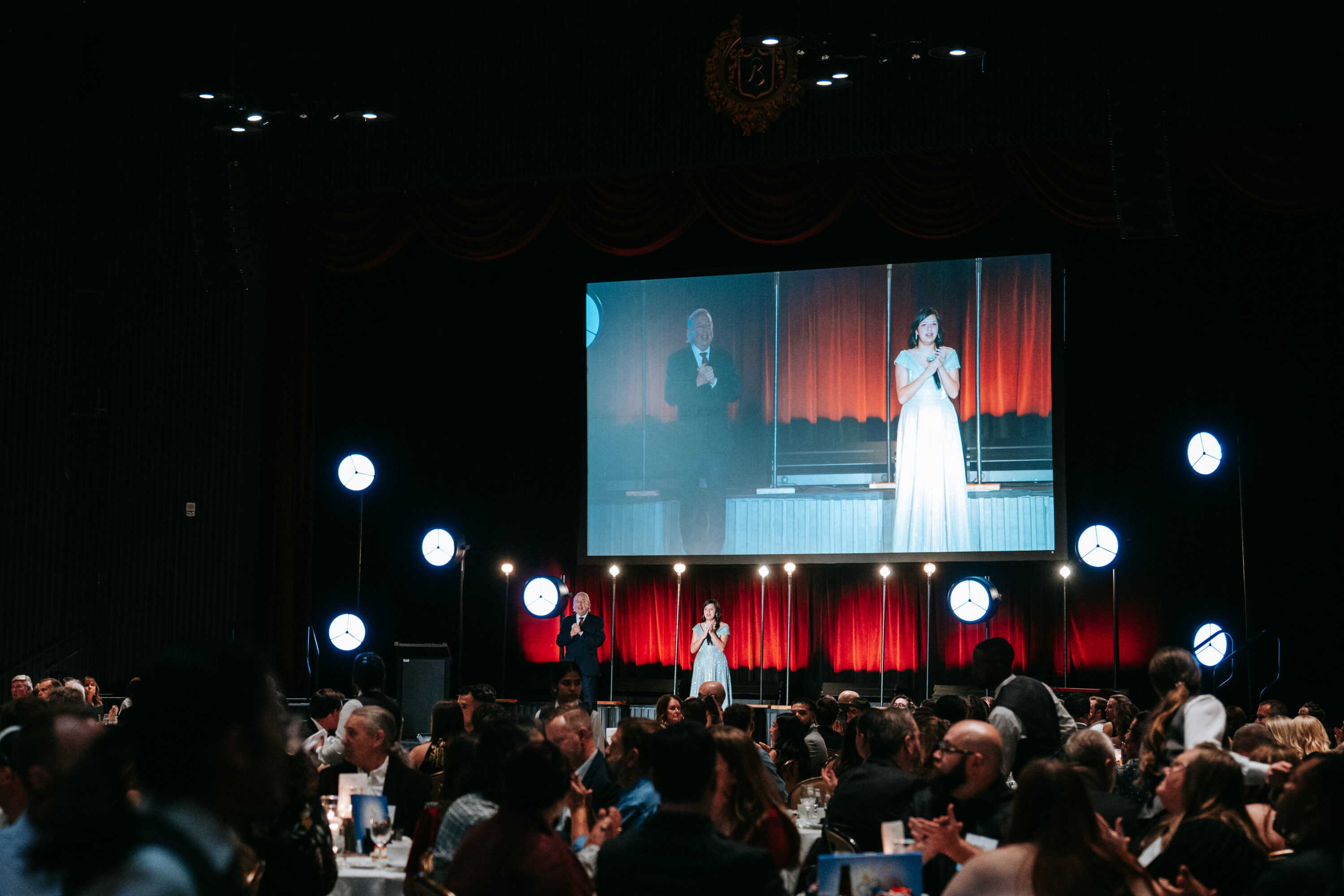 Speakers on stage at formal event dinner