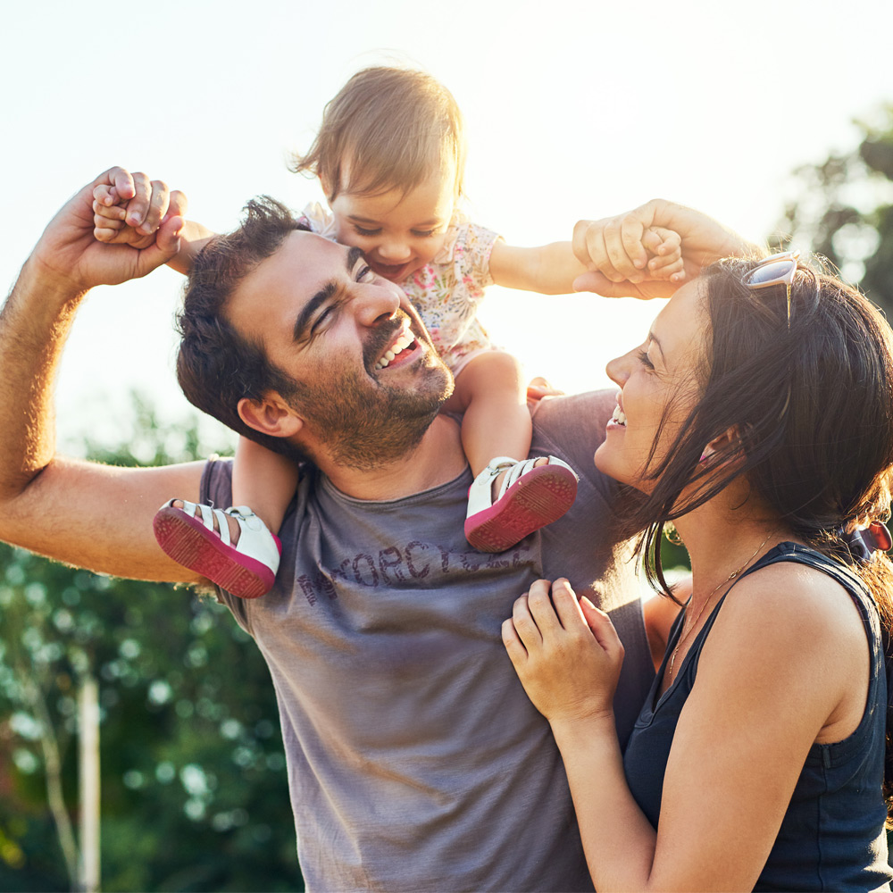 Happy family enjoying time outdoors together