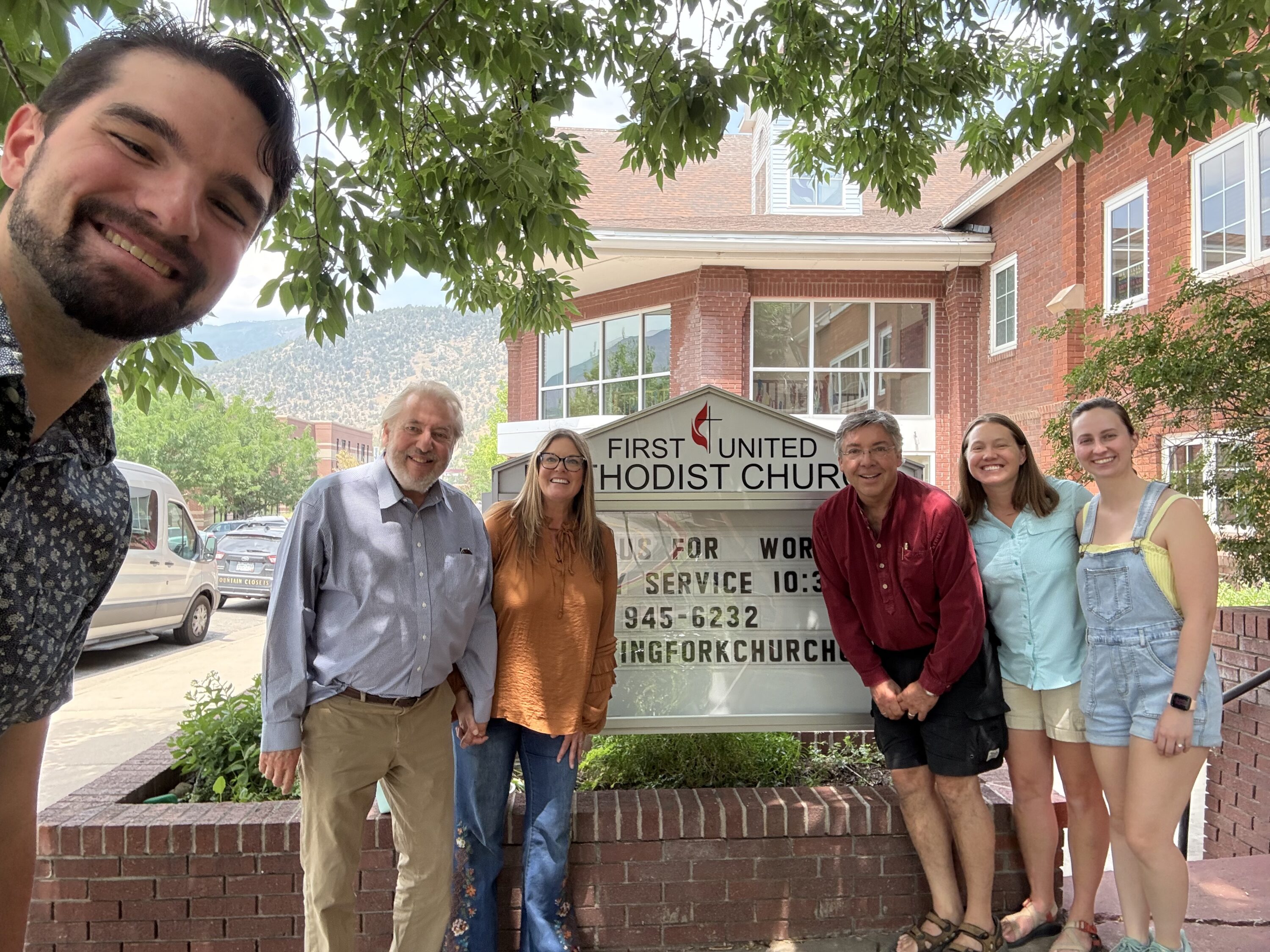 Group smiling outside First United Methodist Church