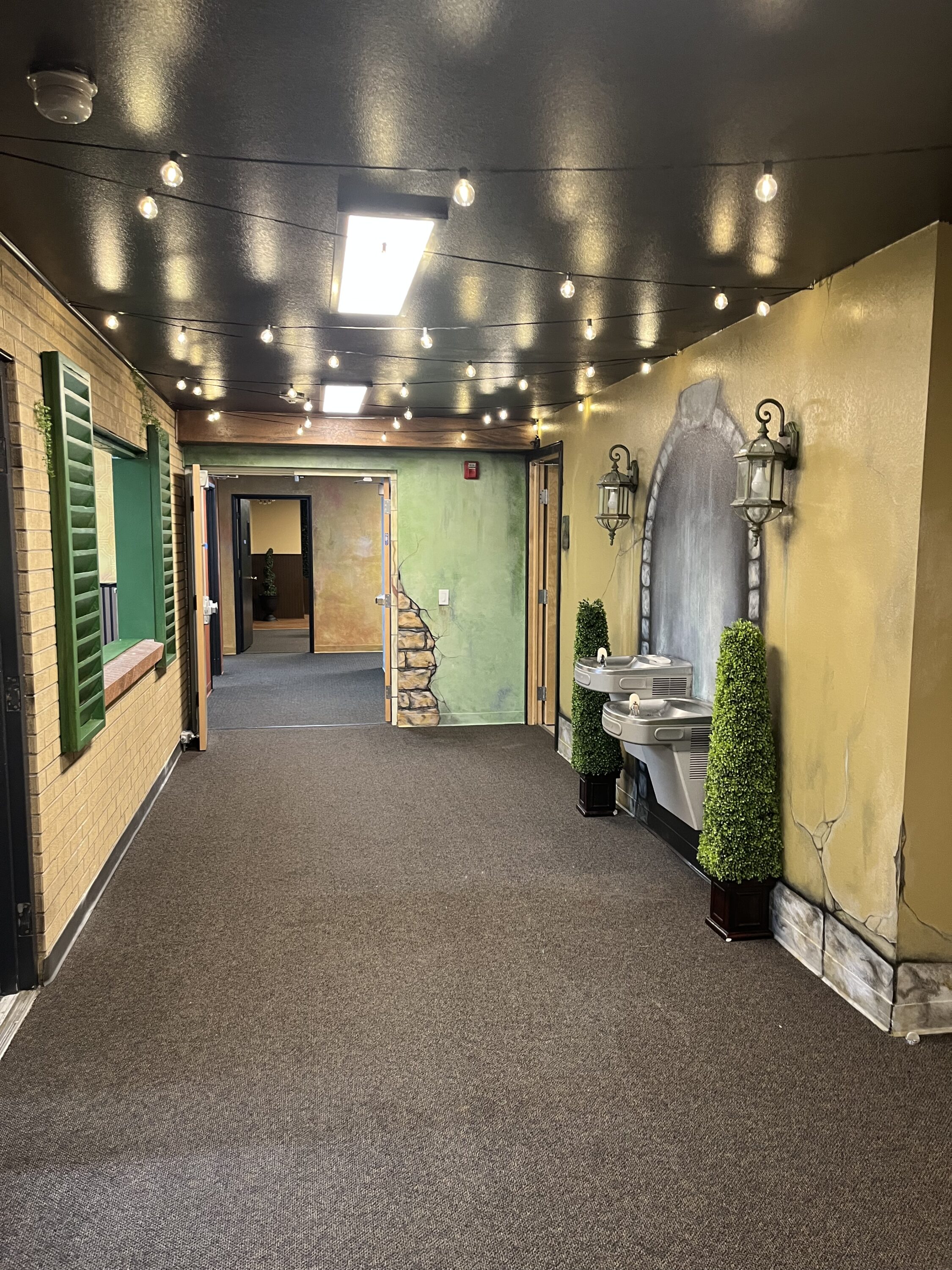 Decorative hallway with lights and water fountains